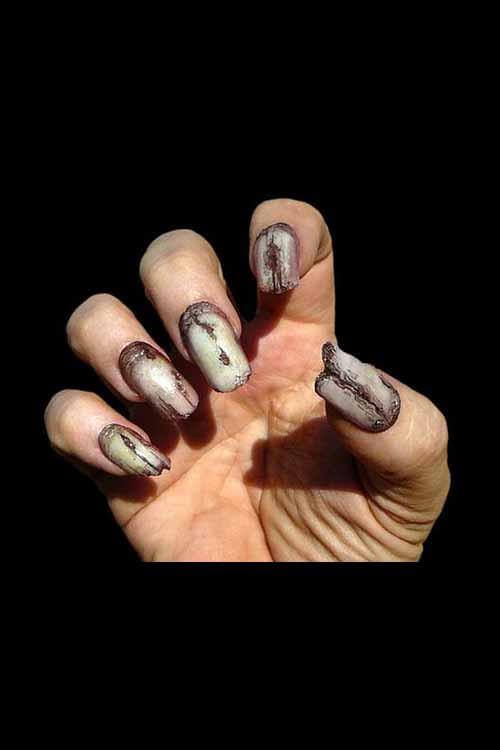 Close-up of hands displaying Dental Distortion special effects nails for LARP and cosplay.