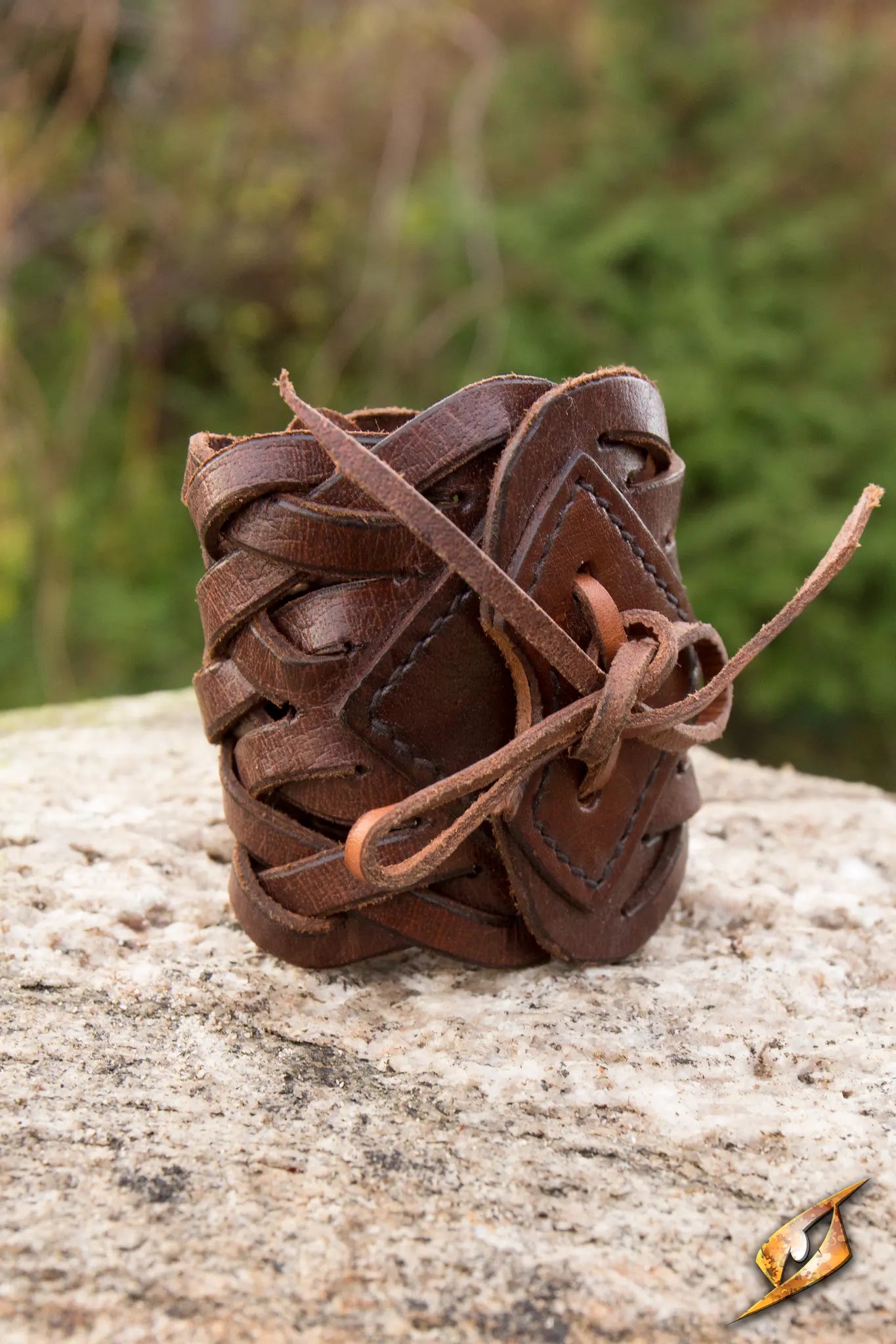 Braided Bracelet made of intricate leather braids, featuring a diamond-shaped brace and tied leather cord.
