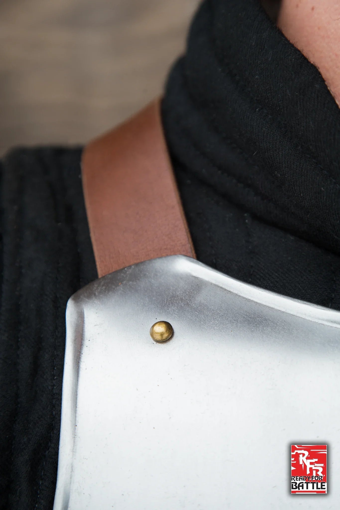 Close-up of RFB Breastplate showing details of the metal and leather straps worn by a soldier.