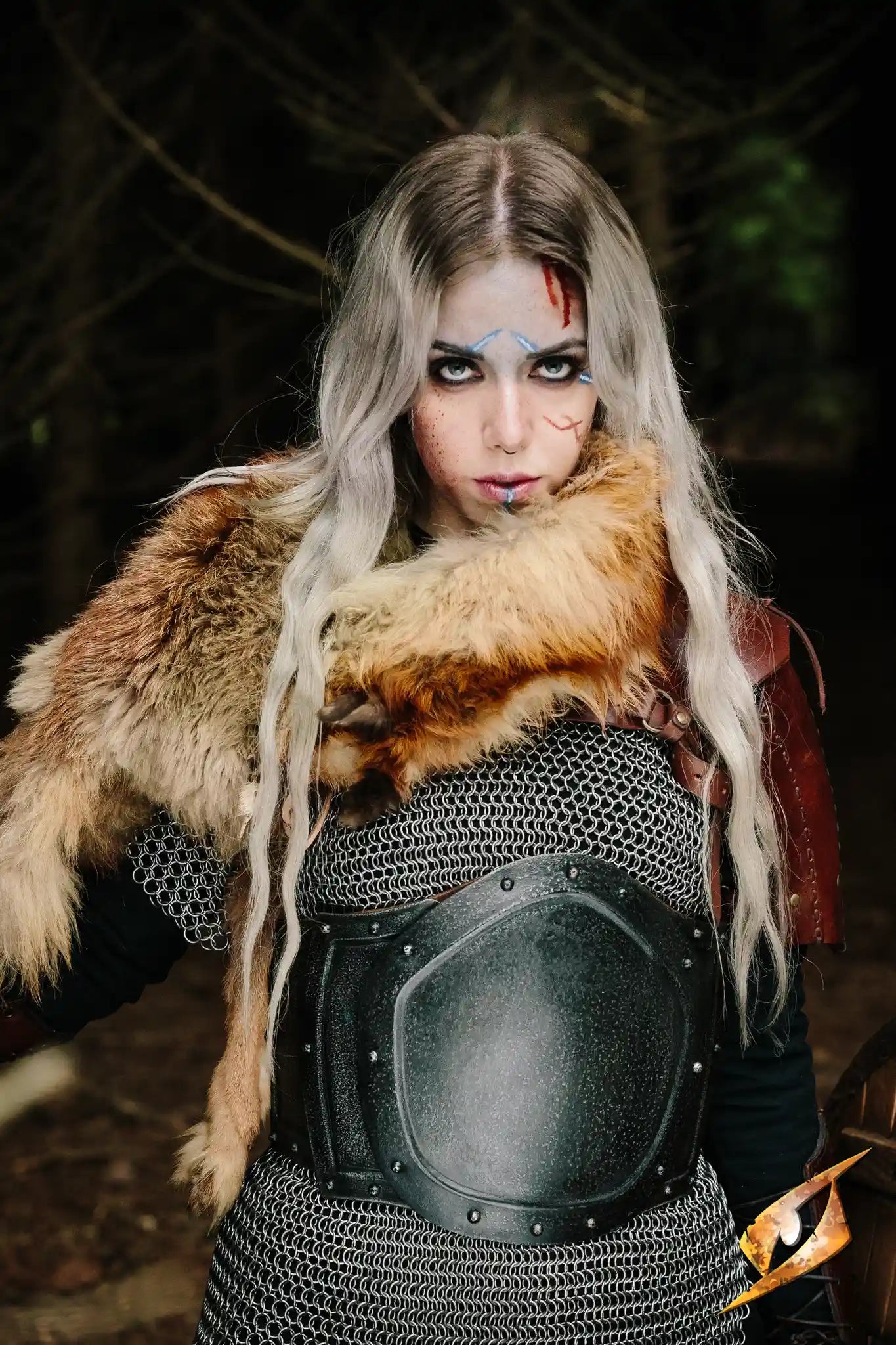 1 female barbarian wearing a gut plate and fur
