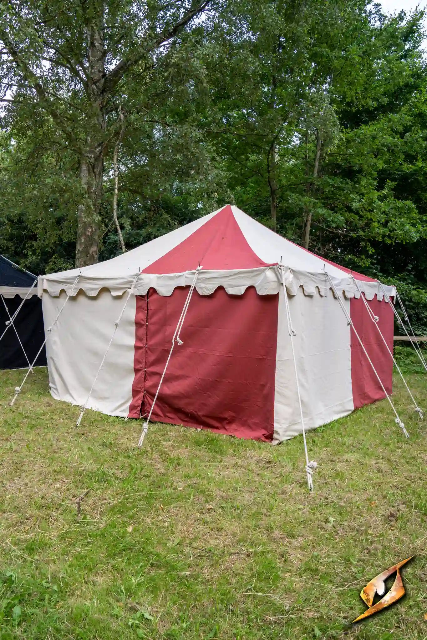 Marquee Tent - 4x4m set up in a grassy area with red and white panels, ideal for events or outdoor gatherings.