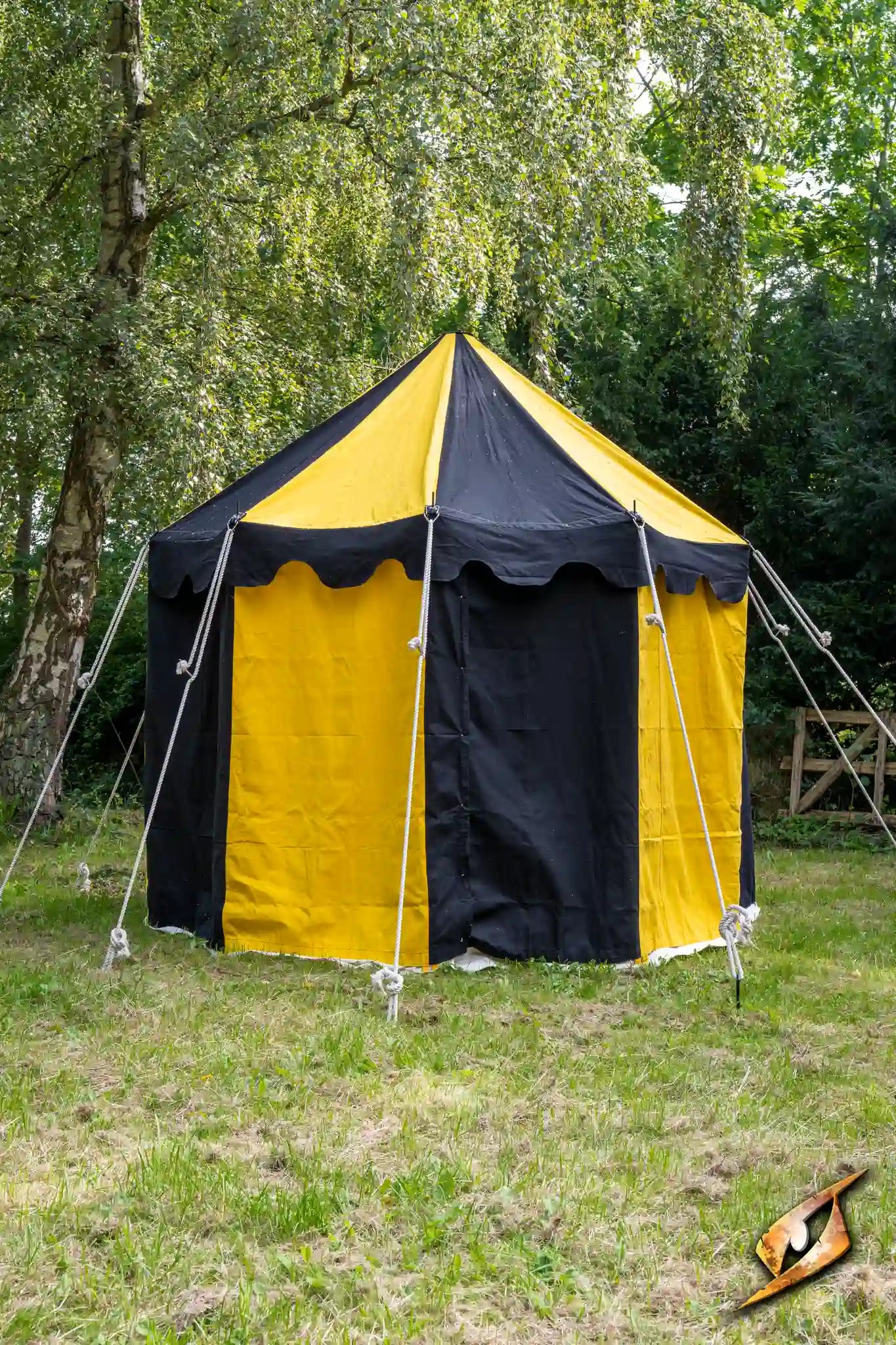 Round Pavilion Tent - 3m in black and yellow, set up in a grassy area surrounded by trees.