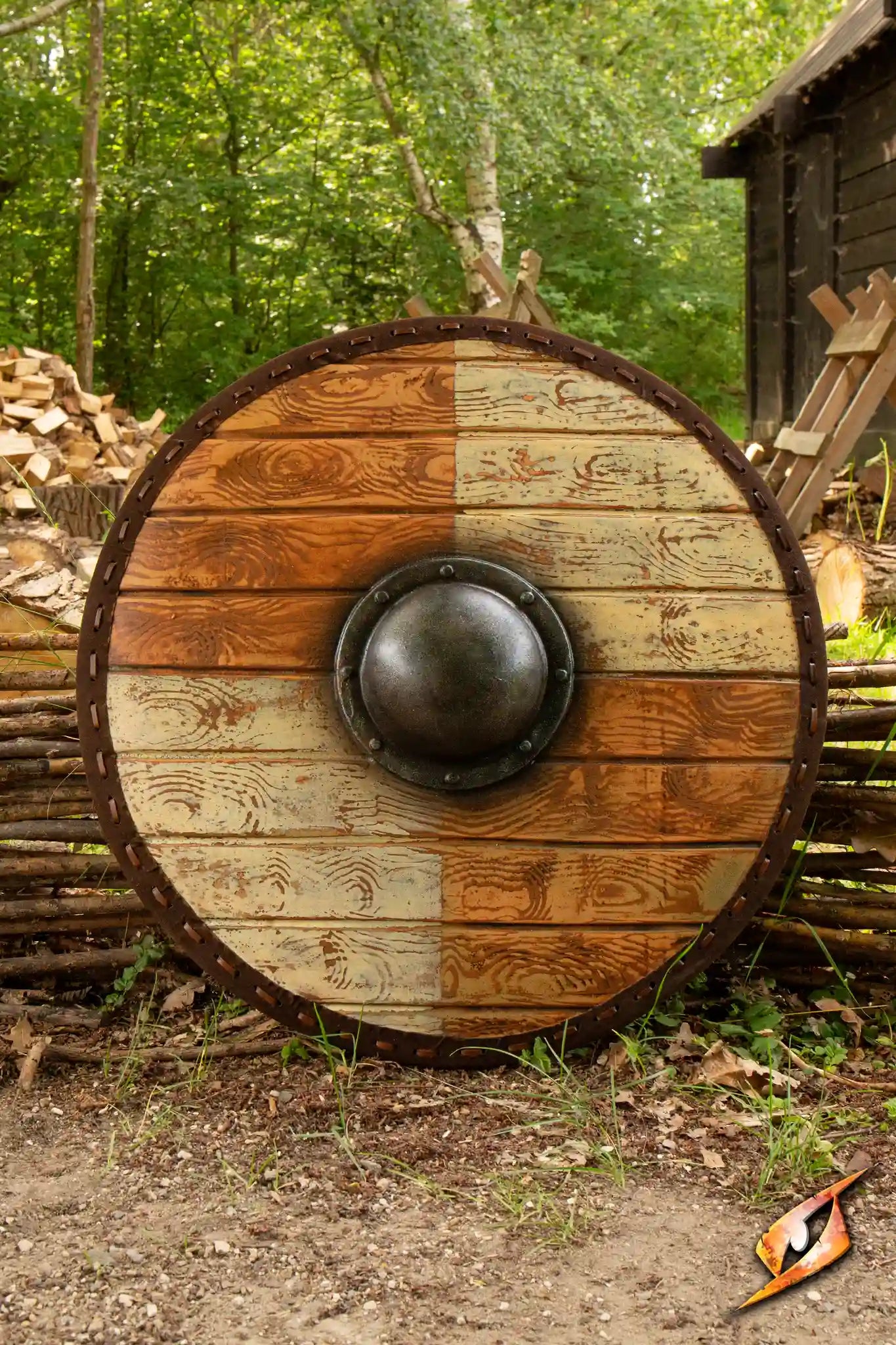 Thegn Shield: A round wooden shield with a metal boss, showcasing red and white sections, perfect for epic battles.