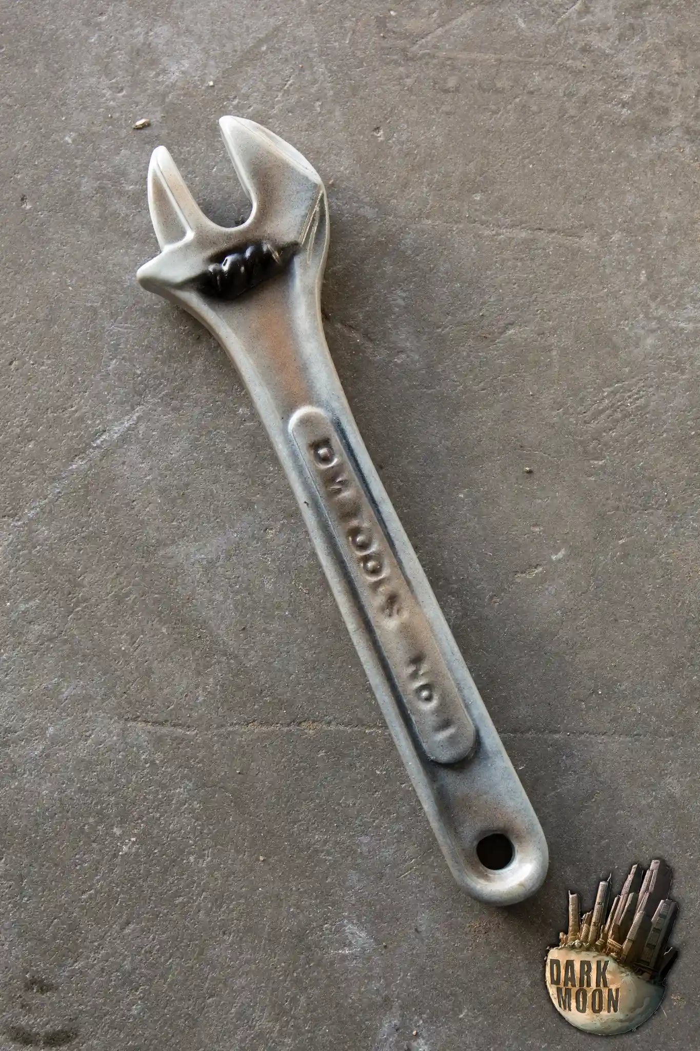 Wrench No. 1 by Dark Moon, a hand-painted open-ended spanner designed as a throwing weapon, 32 cm long.