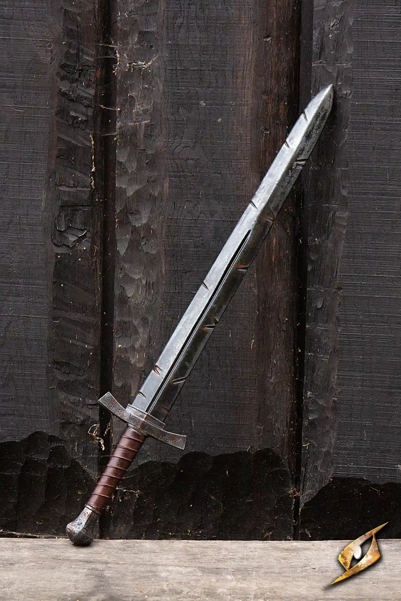 Battleworn Footman Sword resting against a wooden background, featuring realistic details like nicks and scratches.