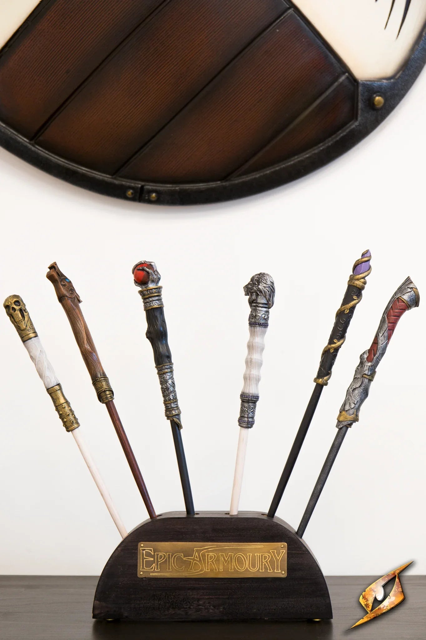 Wand Stand displaying various LARP wands on a wooden block from Epic Armoury.