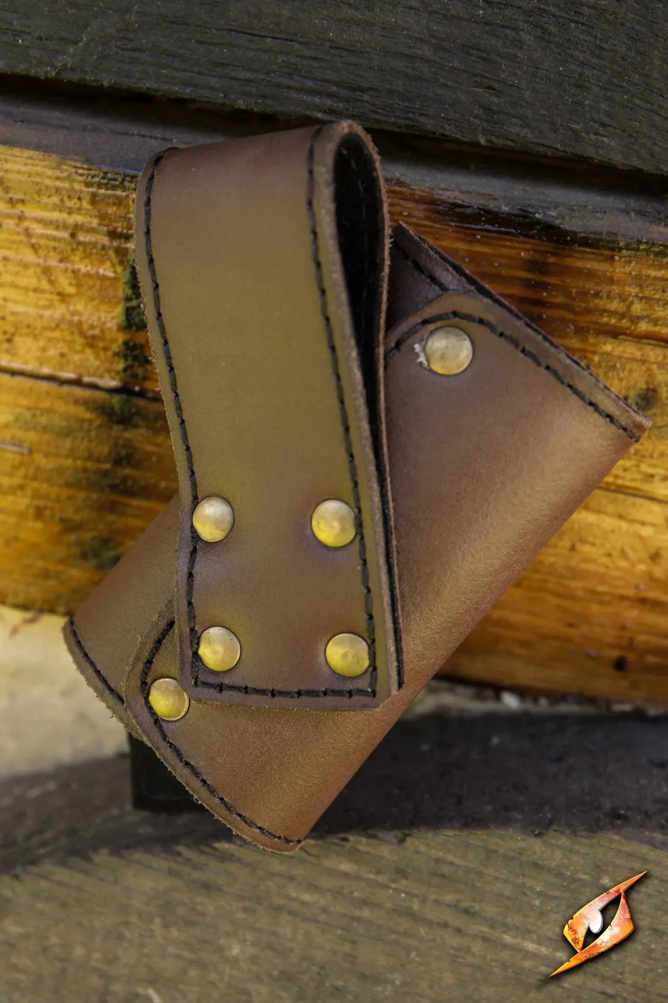 Leather Sword Holder with brass studs, ideal for adventurers keeping their weapon secure on the go.
