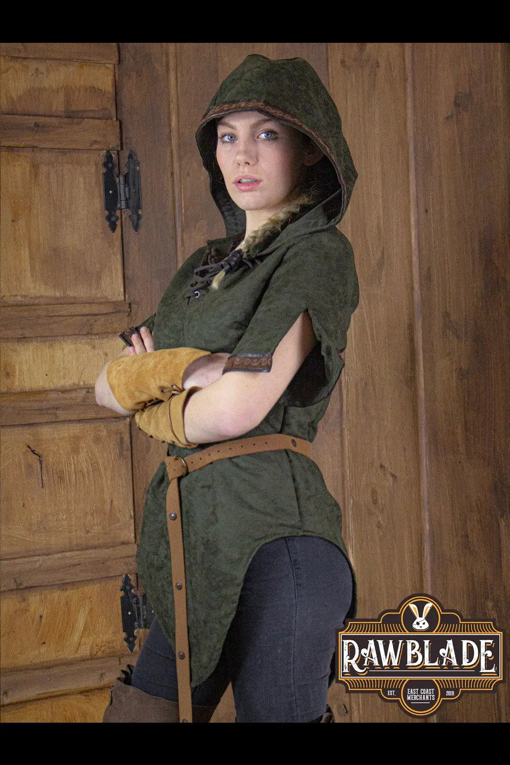 Briannan Ranger Tunic Suede on a model, featuring a hood and leather trims, showcasing stylish medieval fashion.