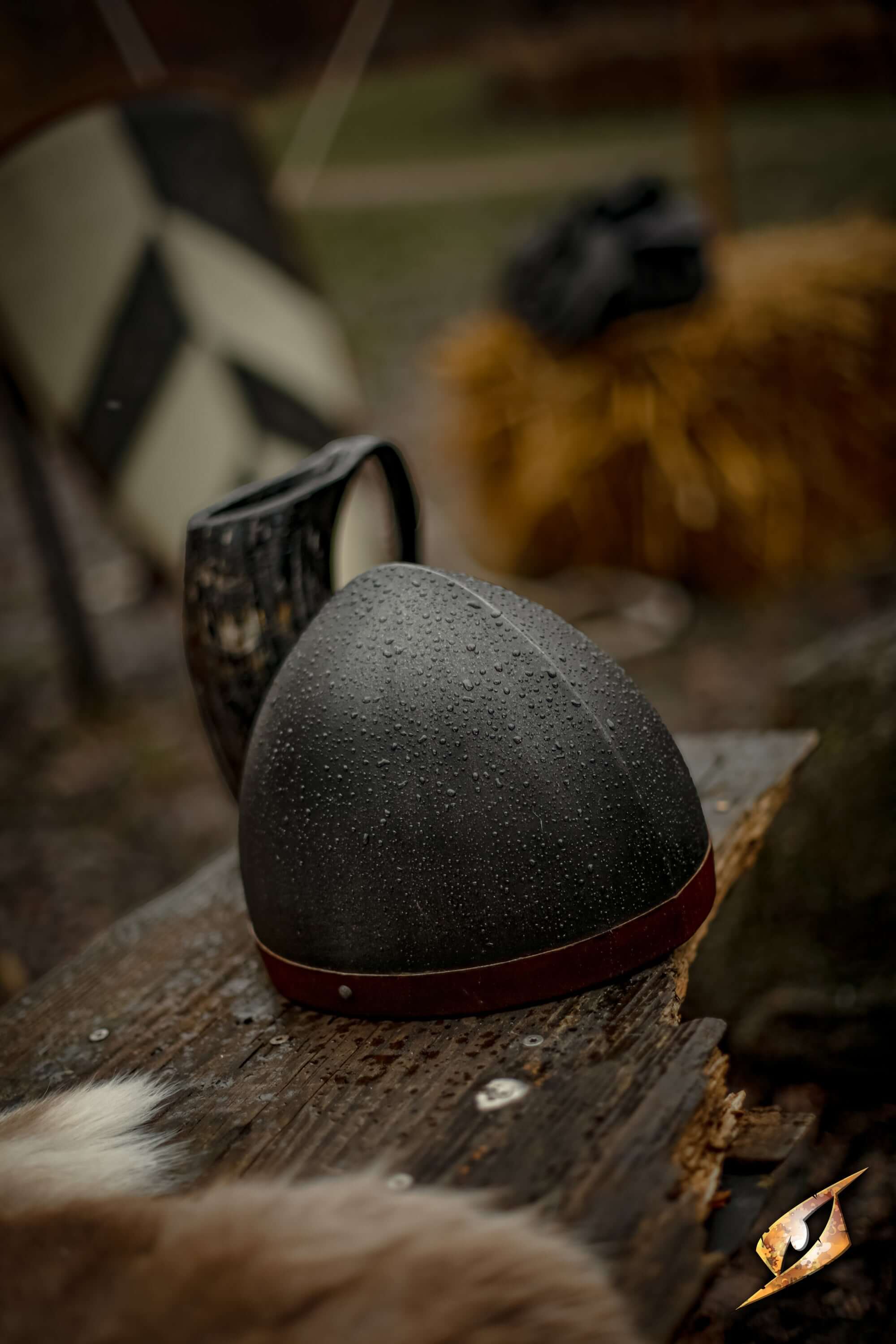Steel Helmets displayed on a wooden table, showcasing their authentic design and historical significance.