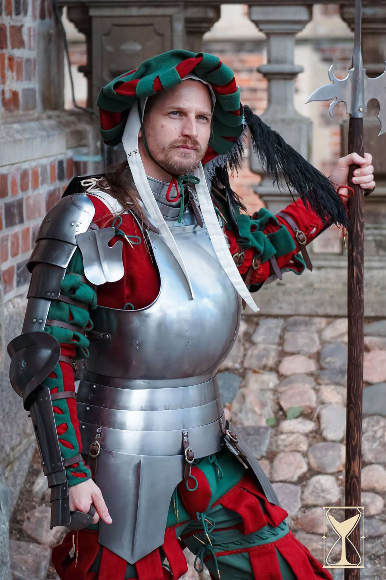 Authentic knight in colourful Armour, showcasing steel plate and costume details, ready for the battlefield.