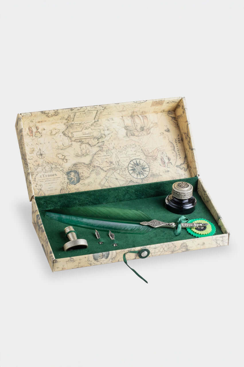 Daillati collection featuring a vintage writing set with quill, ink, and decorative elements in a stylish box.