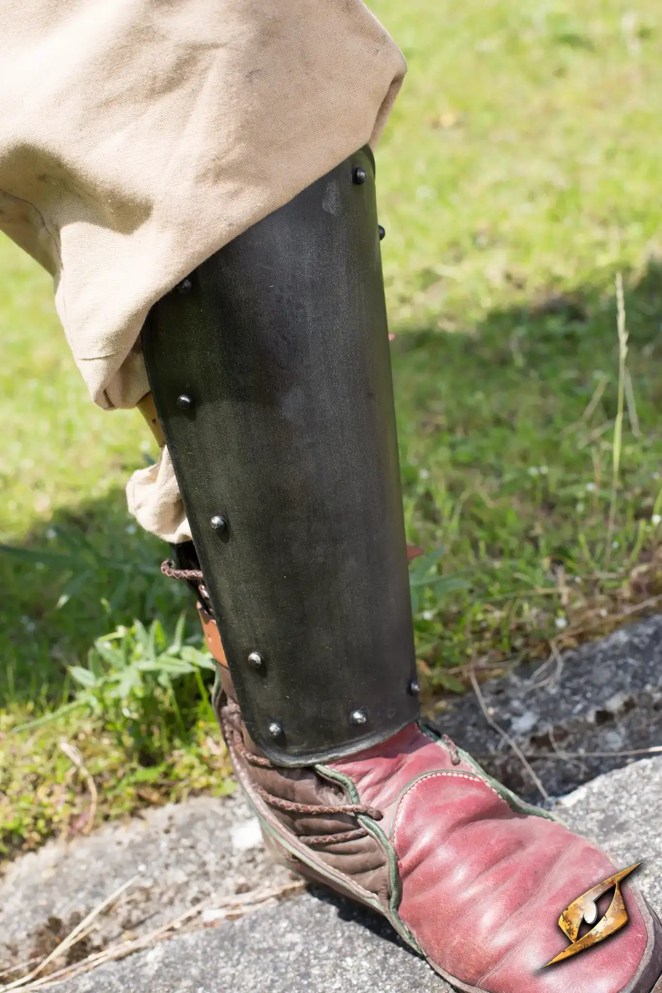 Close-up of leg armor showcasing greaves as part of a collection of Greaves, Cuisses & Leg Armor.