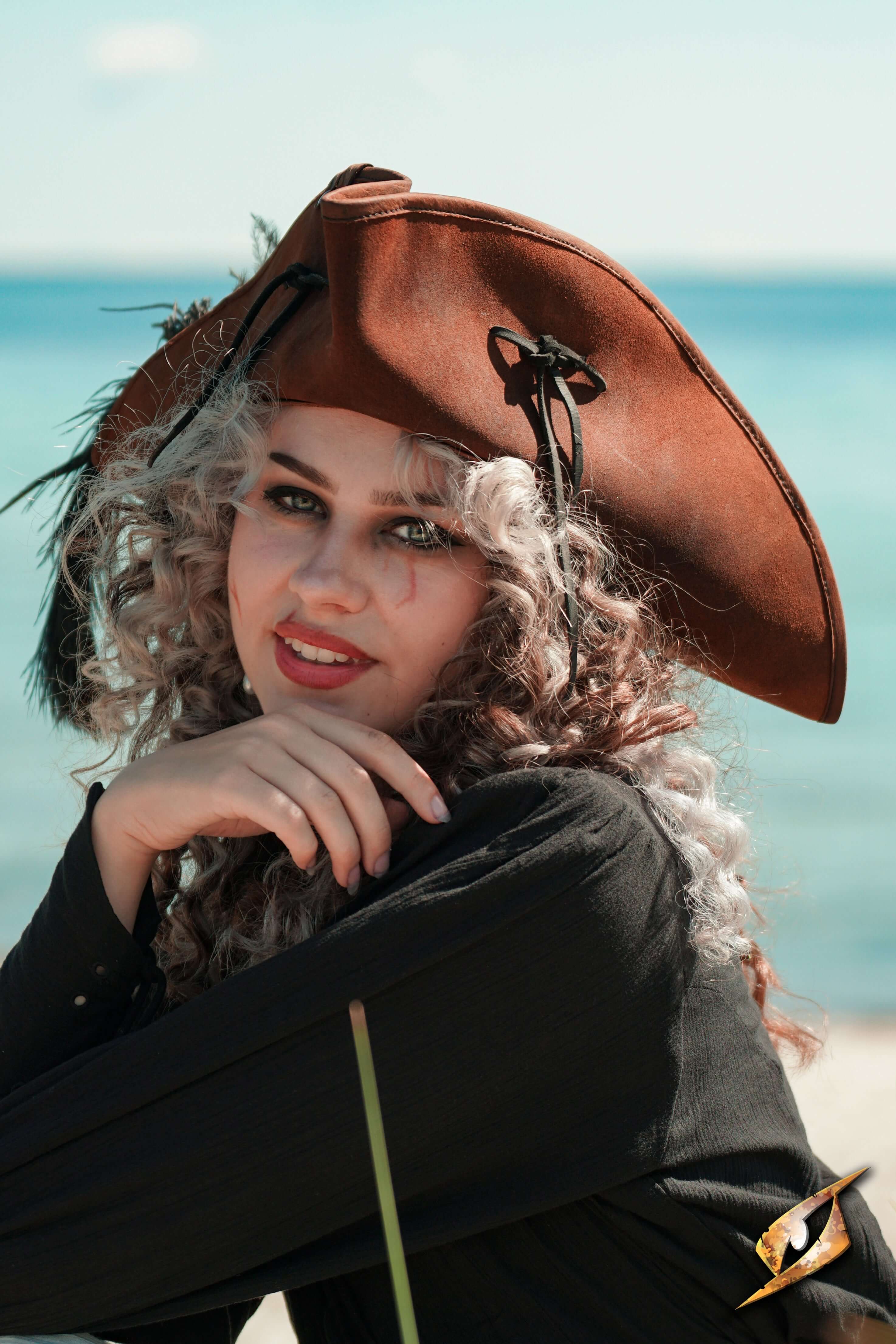 Leather Hats featuring a stylish brown pirate hat worn by a woman by the ocean.
