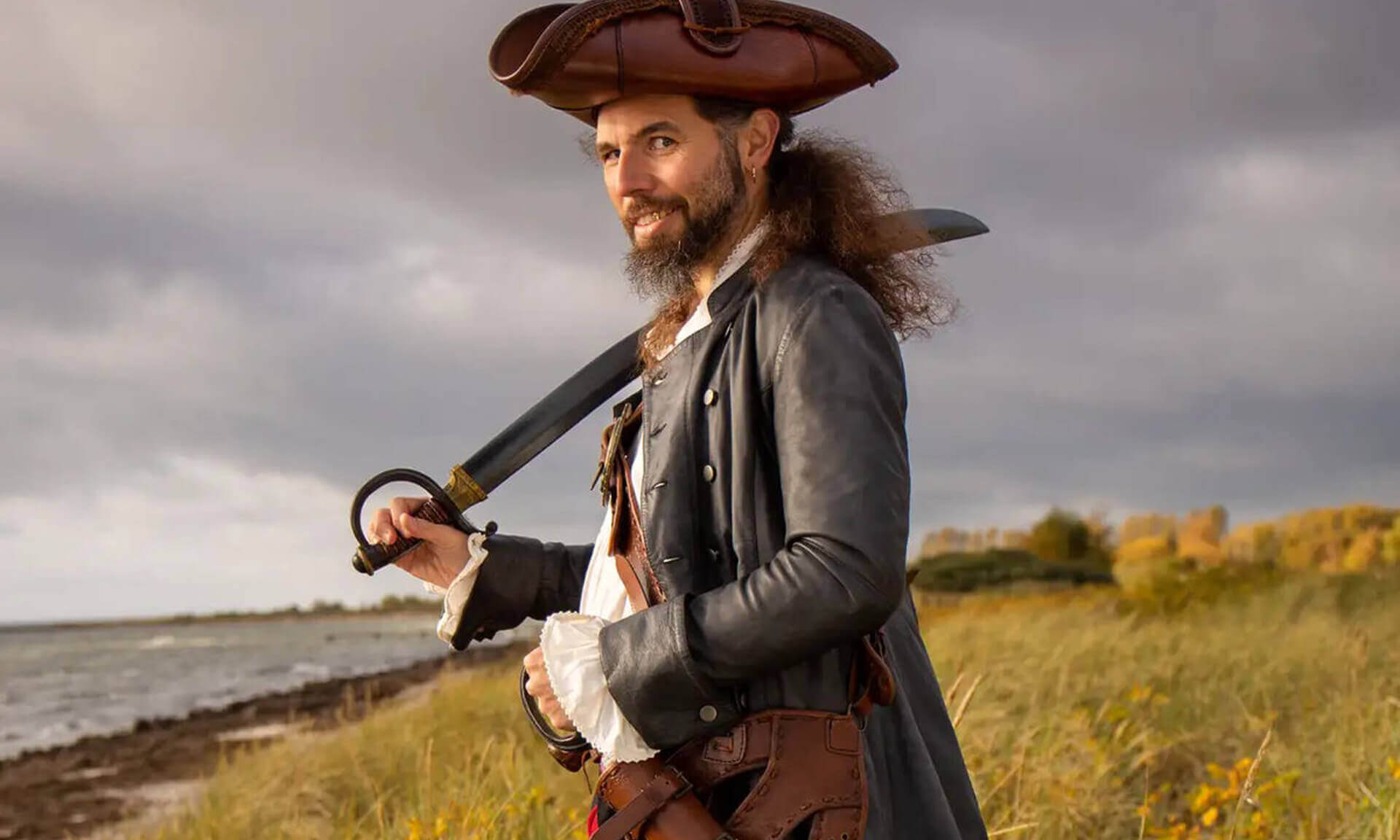 Pirates: A confident pirate holding a sword, standing by the sea with a dramatic sky.