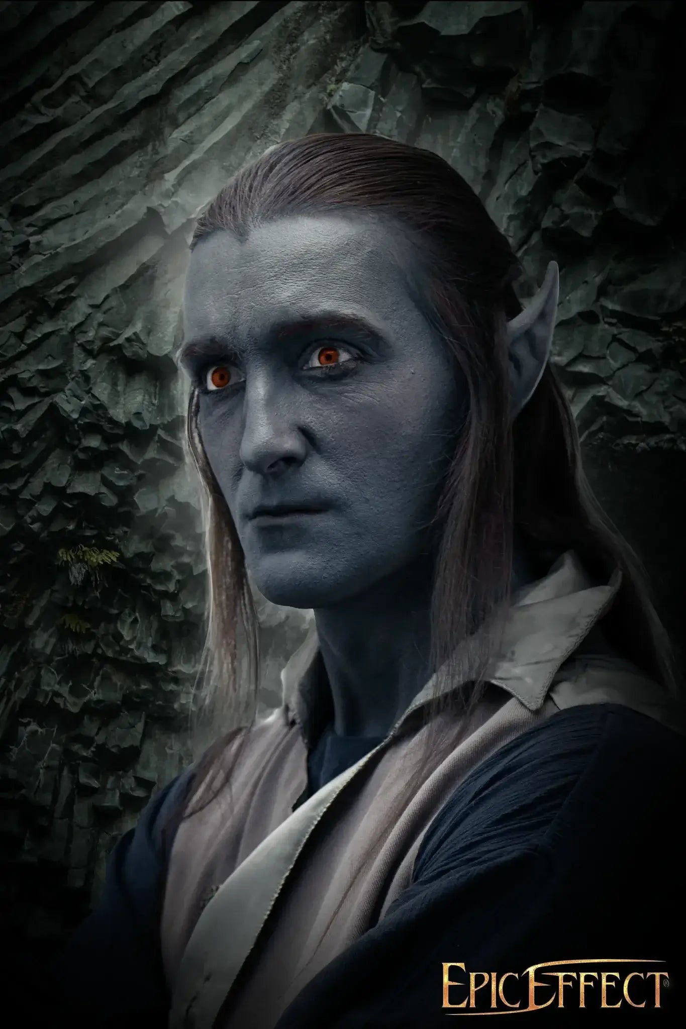 Portrait of a character with blue skin and pointed ears, showcasing the fantasy theme in prosthetics.