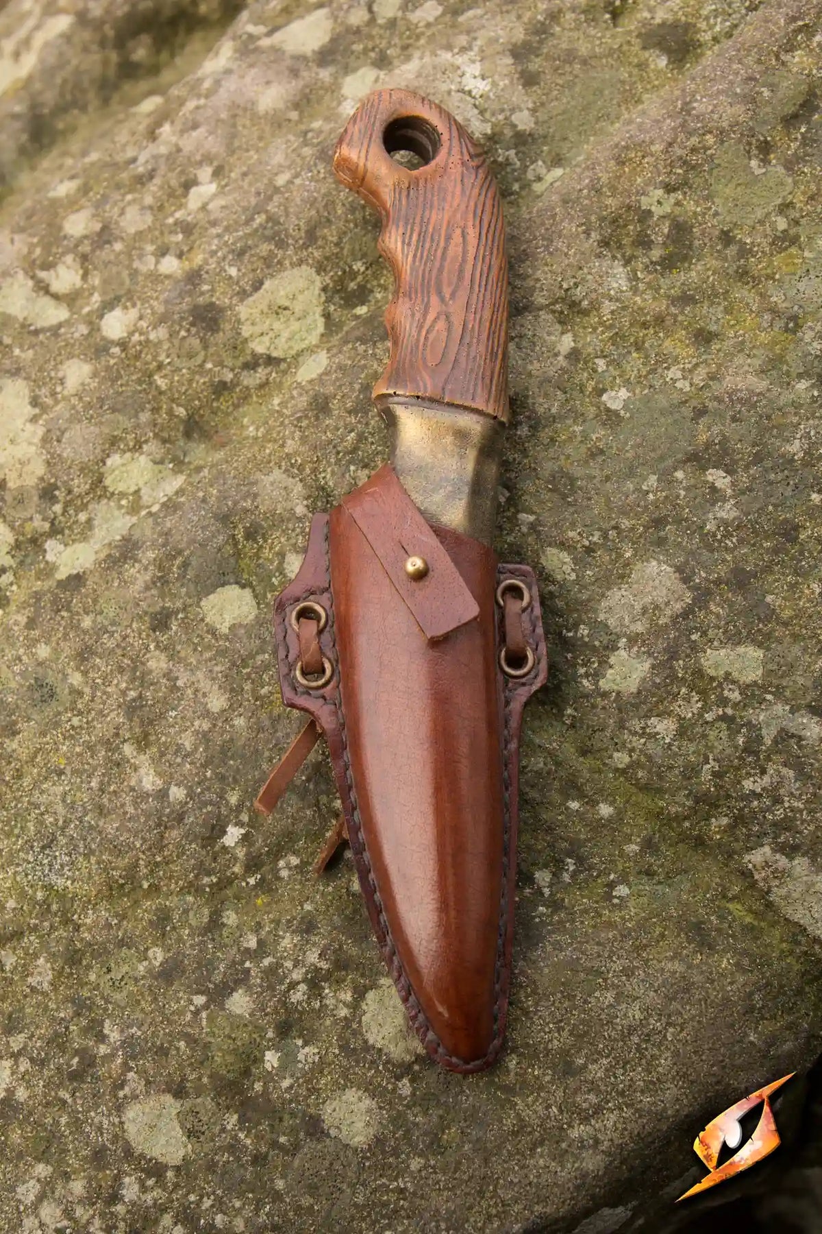 Woodsman Knife & Holder featuring a handmade brown leather holder with a secured knife, perfect for outdoor adventures.