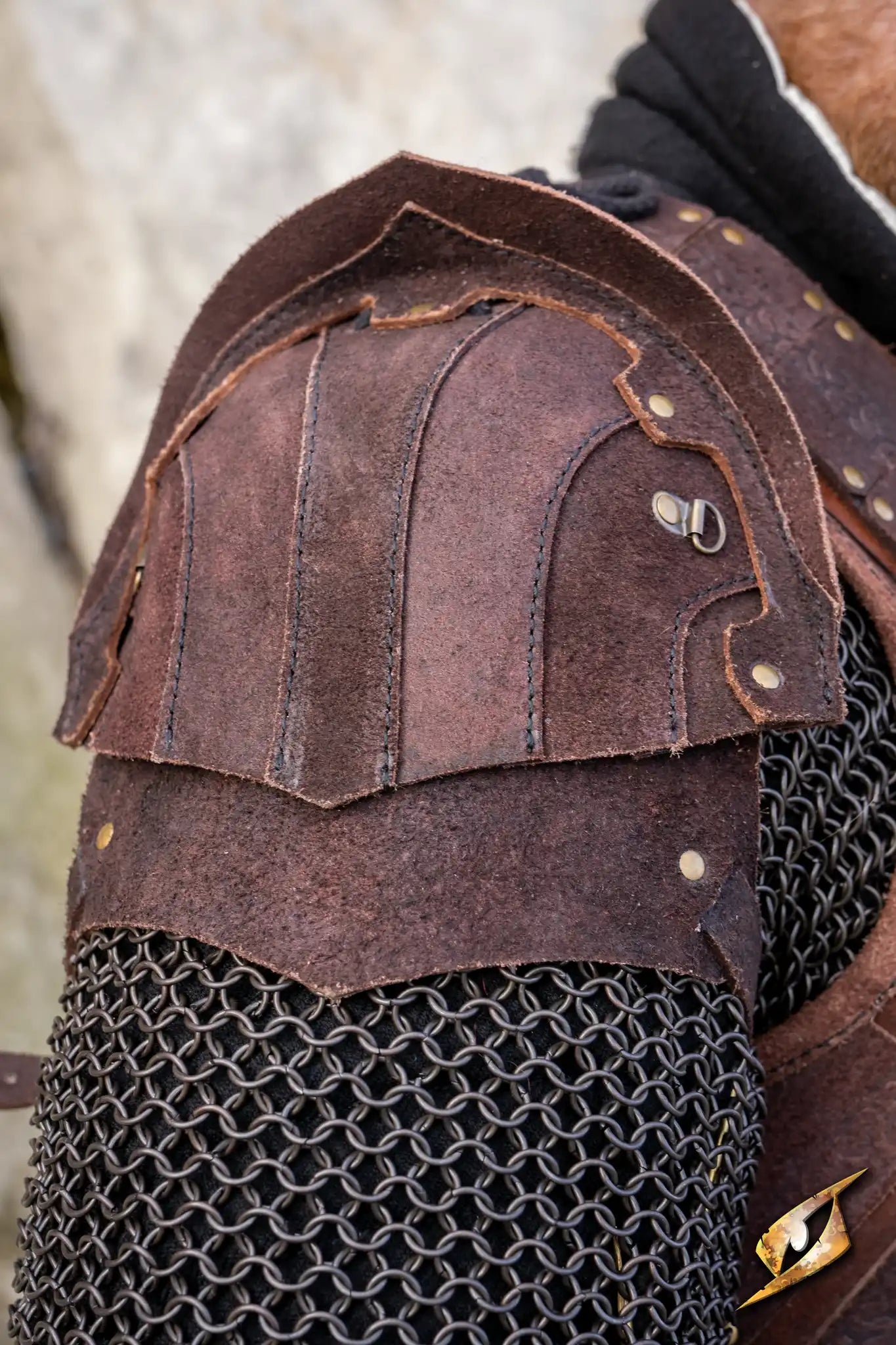 Woodsman Suede Shoulder Armour featuring sturdy brown suede construction and intricate design for LARP battles.