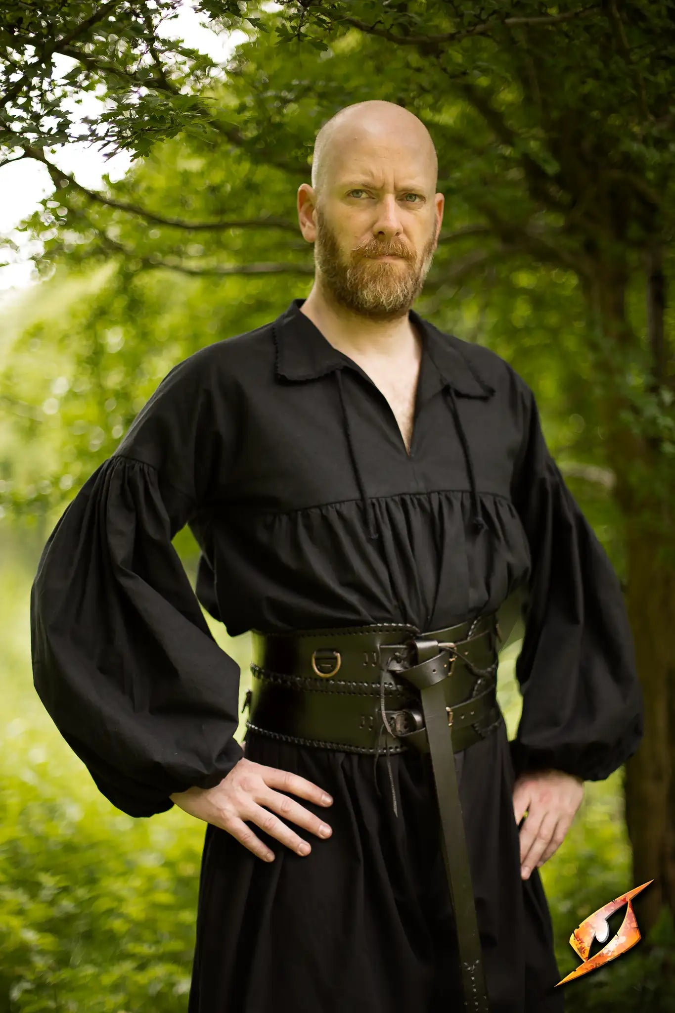 Man wearing a black costume with a Broad Belt, showcasing its sturdy leather design and adjustable D-rings.
