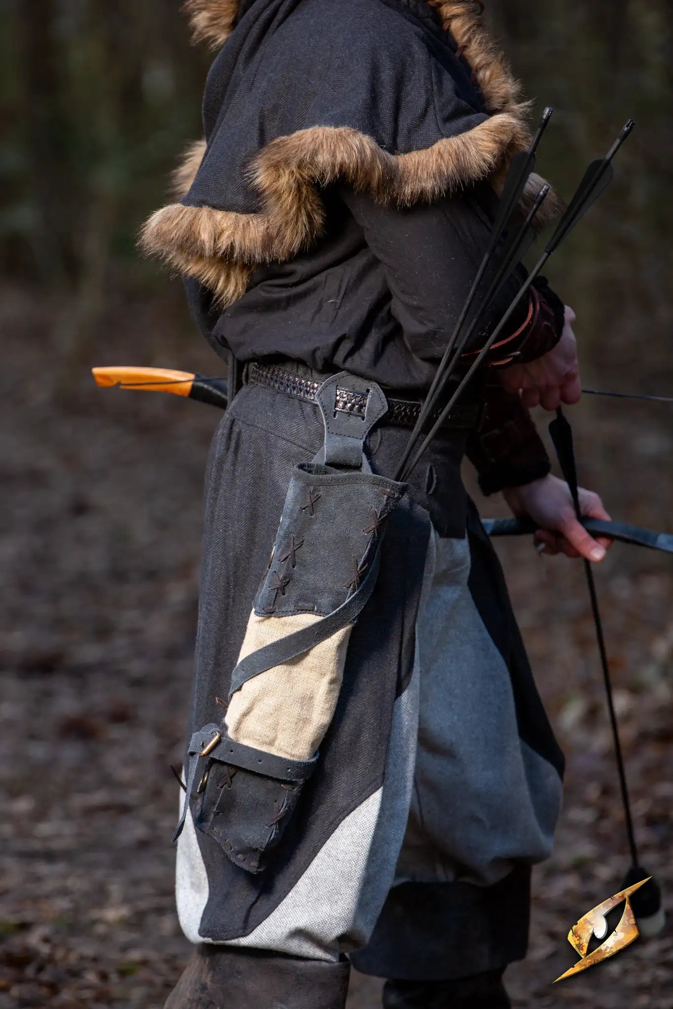 Wildling Quiver - Suede carried by a person in a forest setting, featuring suede leather and beige canvas.