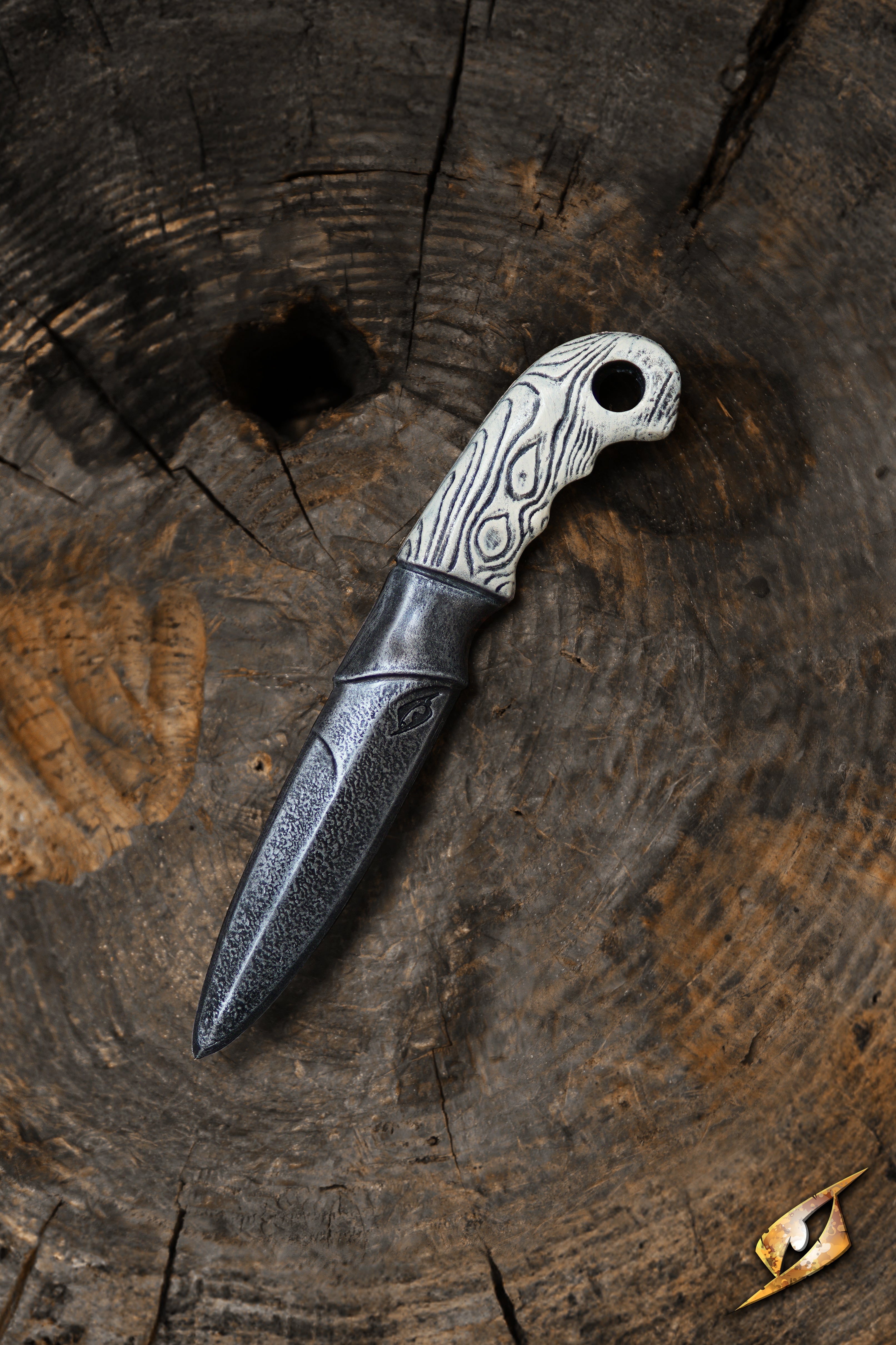 Woodsman Knife - 23 cm displayed on a rustic wooden surface, highlighting its sharp blade and textured handle.
