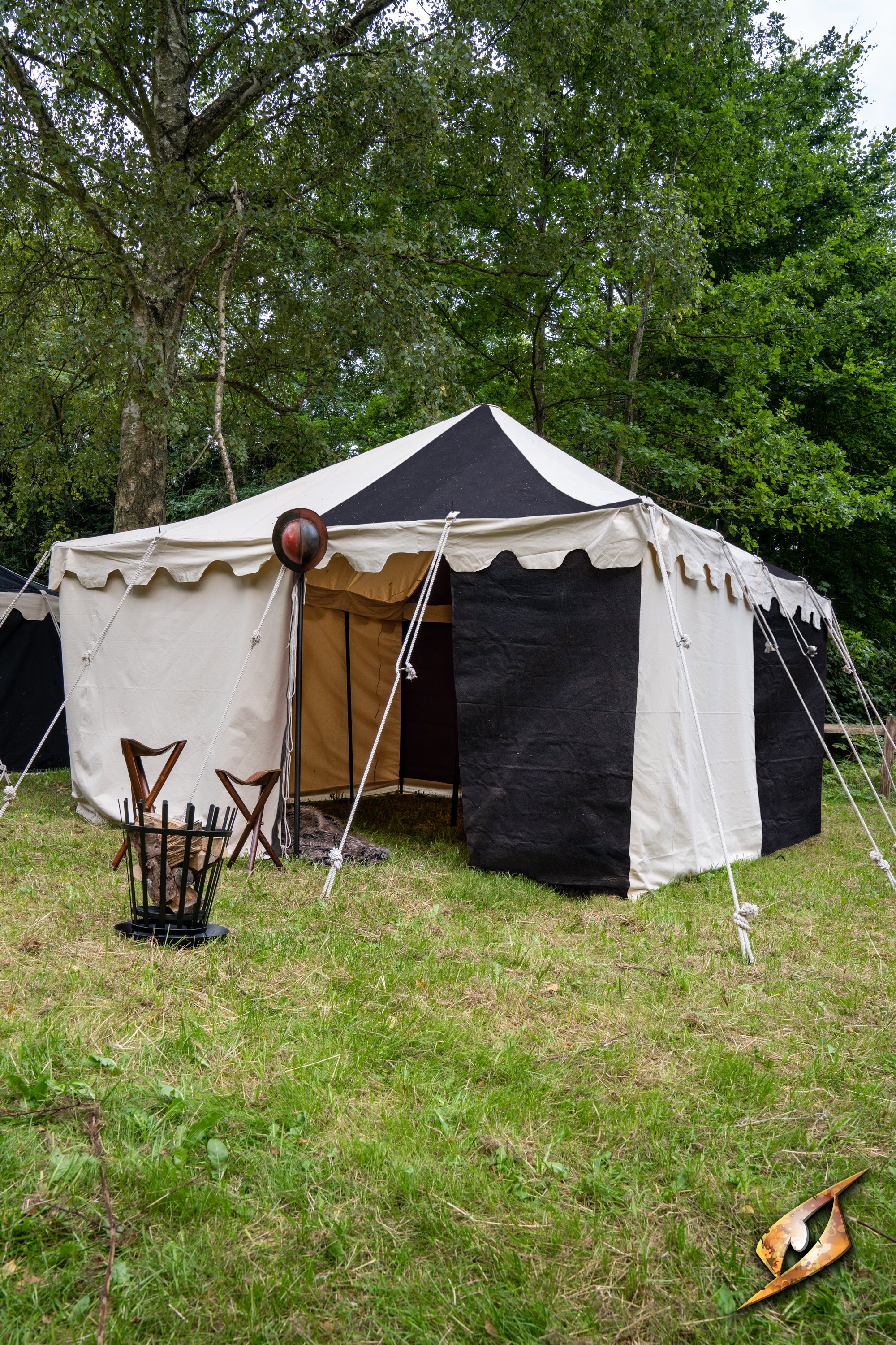 Marquee Tent - 4x4m set up in a grassy field with a mix of black and white fabric.