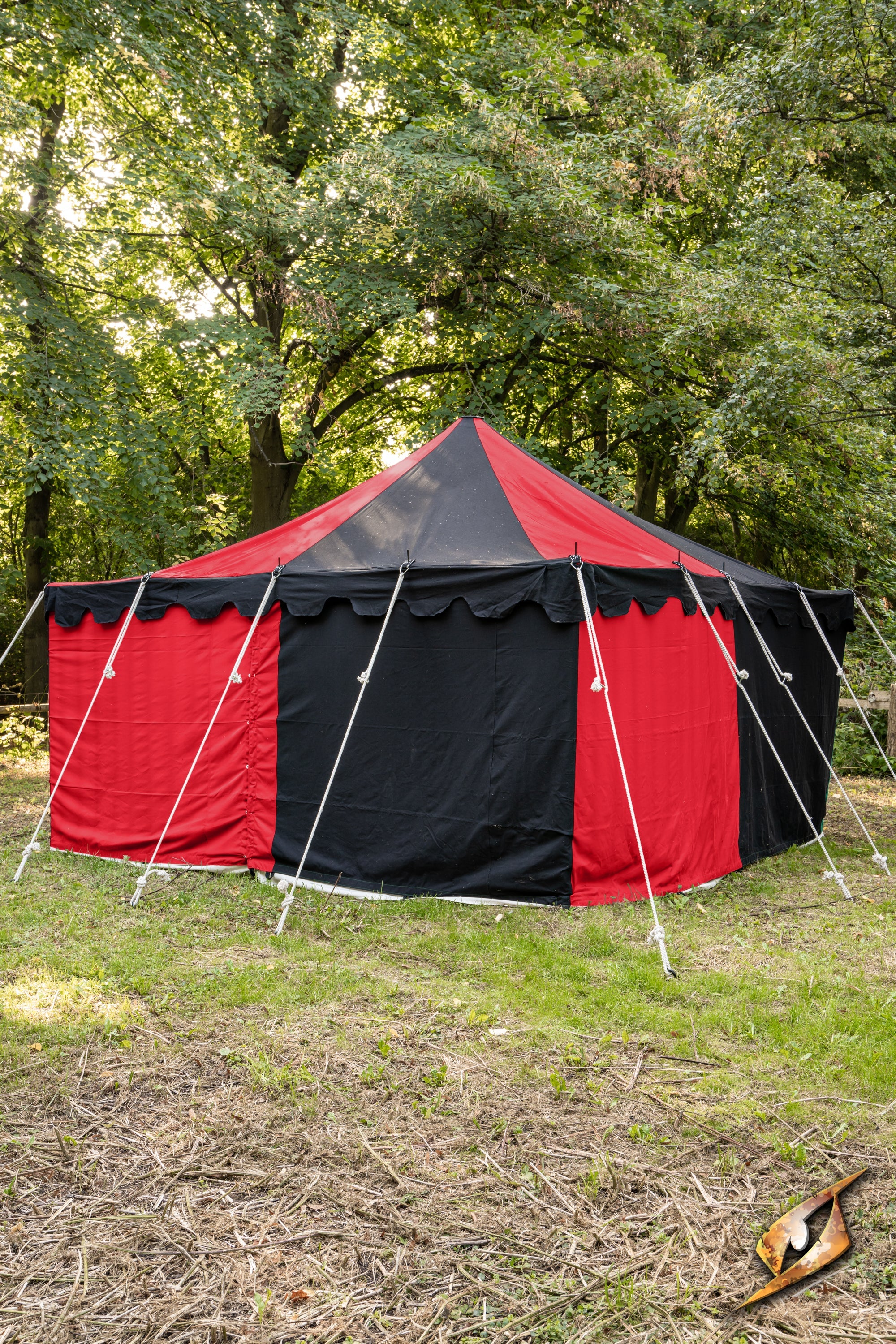 Marquee Tent - 4x4m displayed in a lush green outdoor setting with red and black fabric.