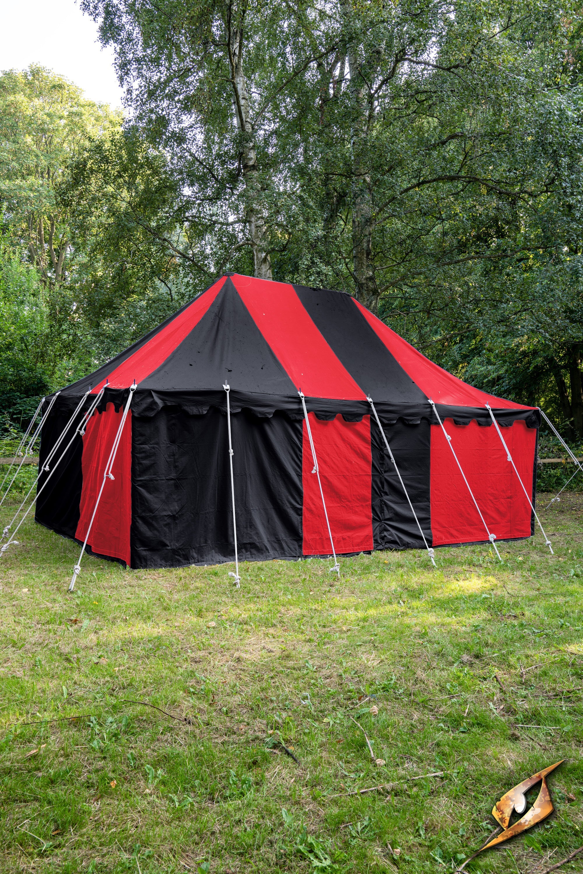 Marquee Tent - 4x6m set in a natural green landscape, showcasing vibrant red and black canopy.