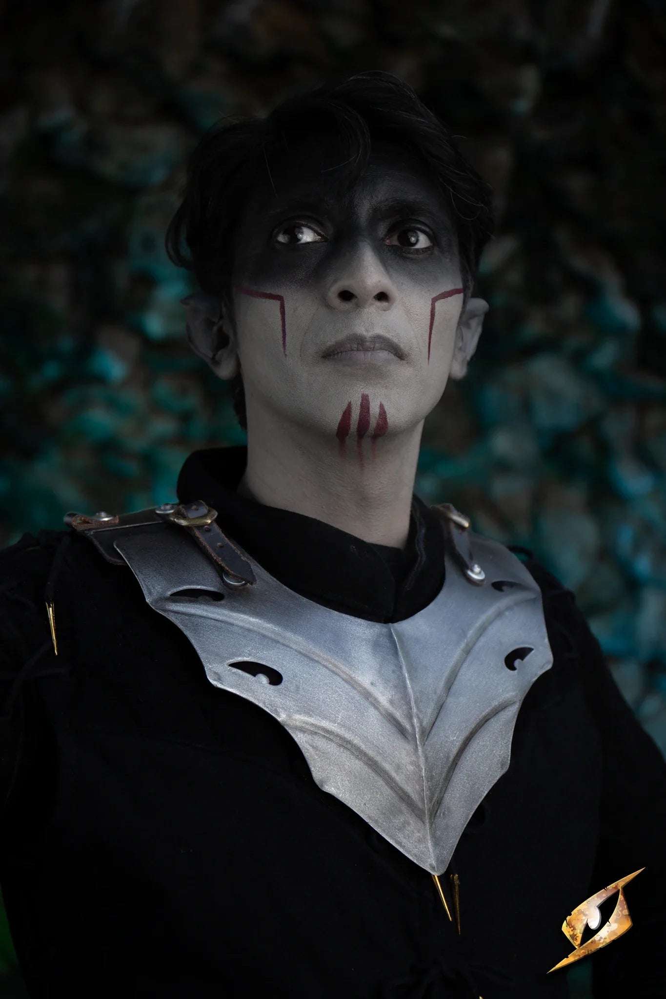 Eventide Gorget worn by a character with dark makeup, showcasing its protective design in a dramatic setting.