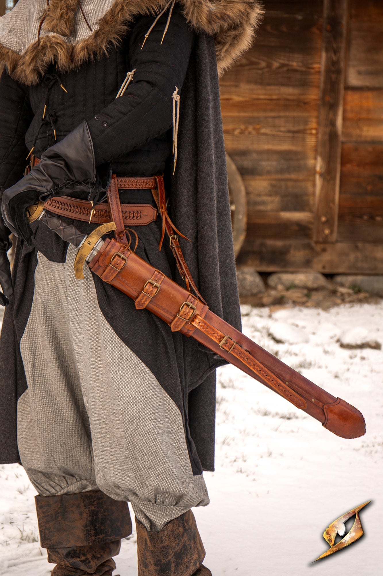 Person wearing an Adjustable Scabbard with a sword, showcasing the leather design and adjustable features.