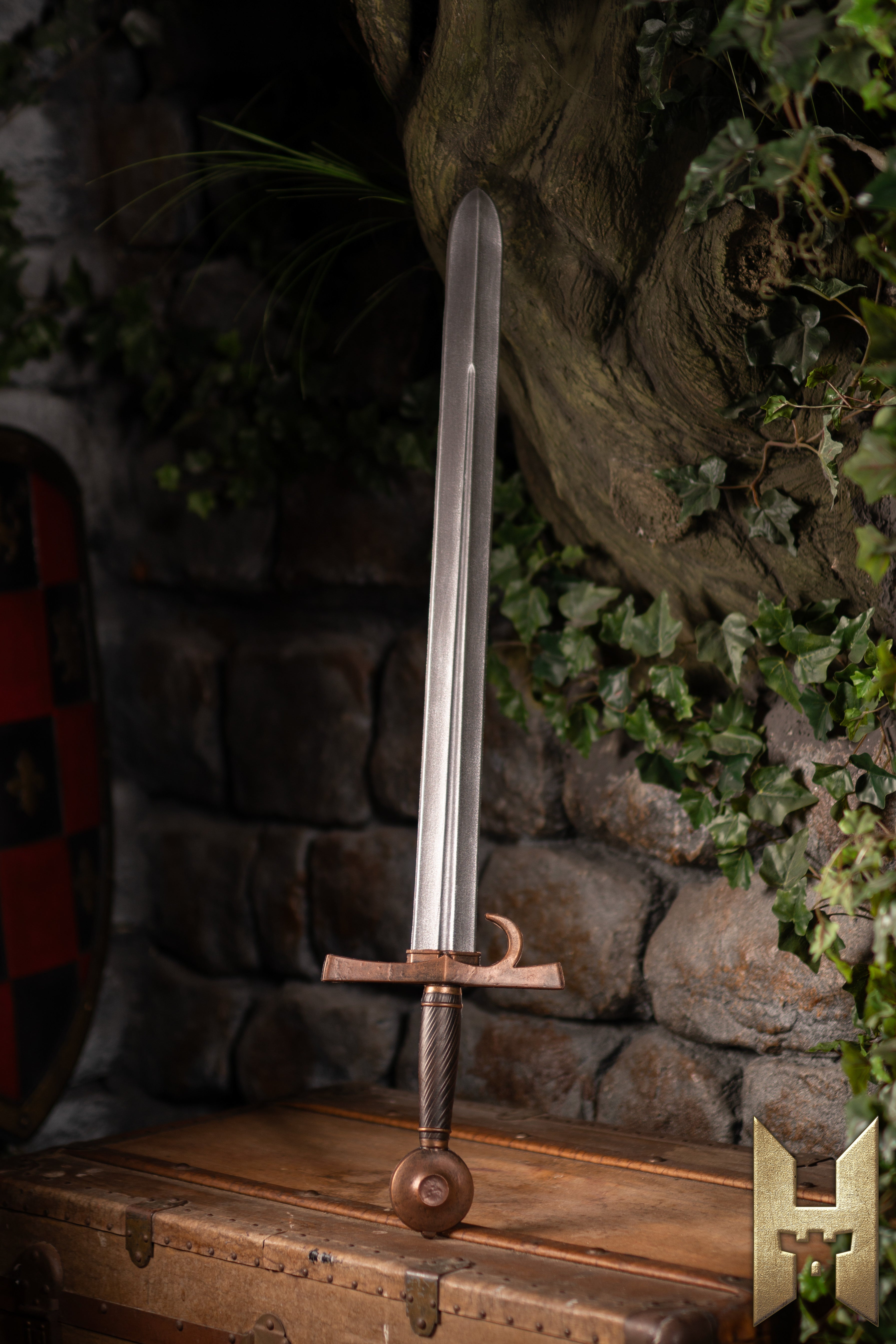 Milanese Sword displayed against a stone wall, showcasing its elegant design and durability from Epic Armoury.