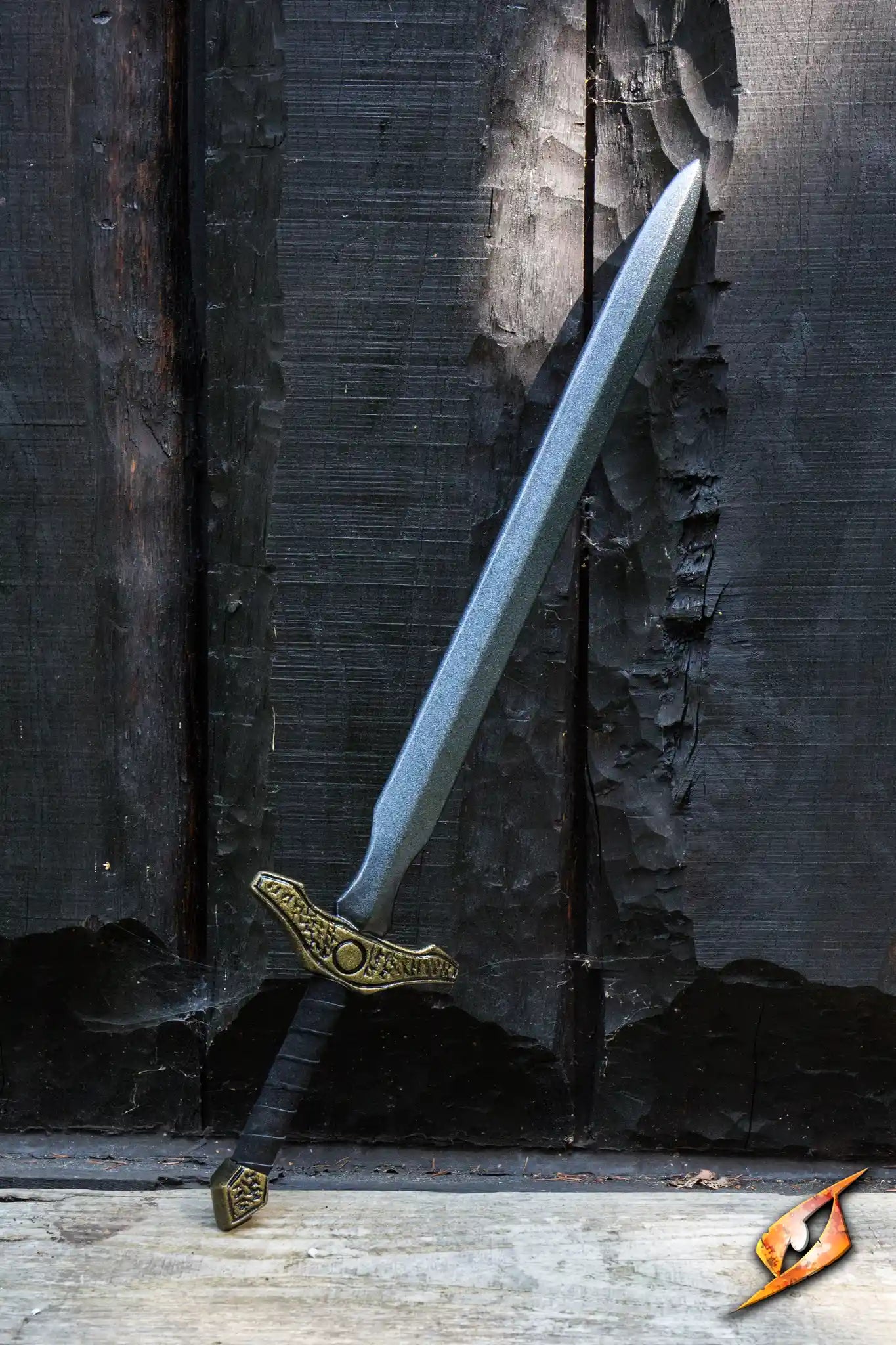 Adventure - 85 cm sword leaning against a wooden wall, ready for action and adventure.