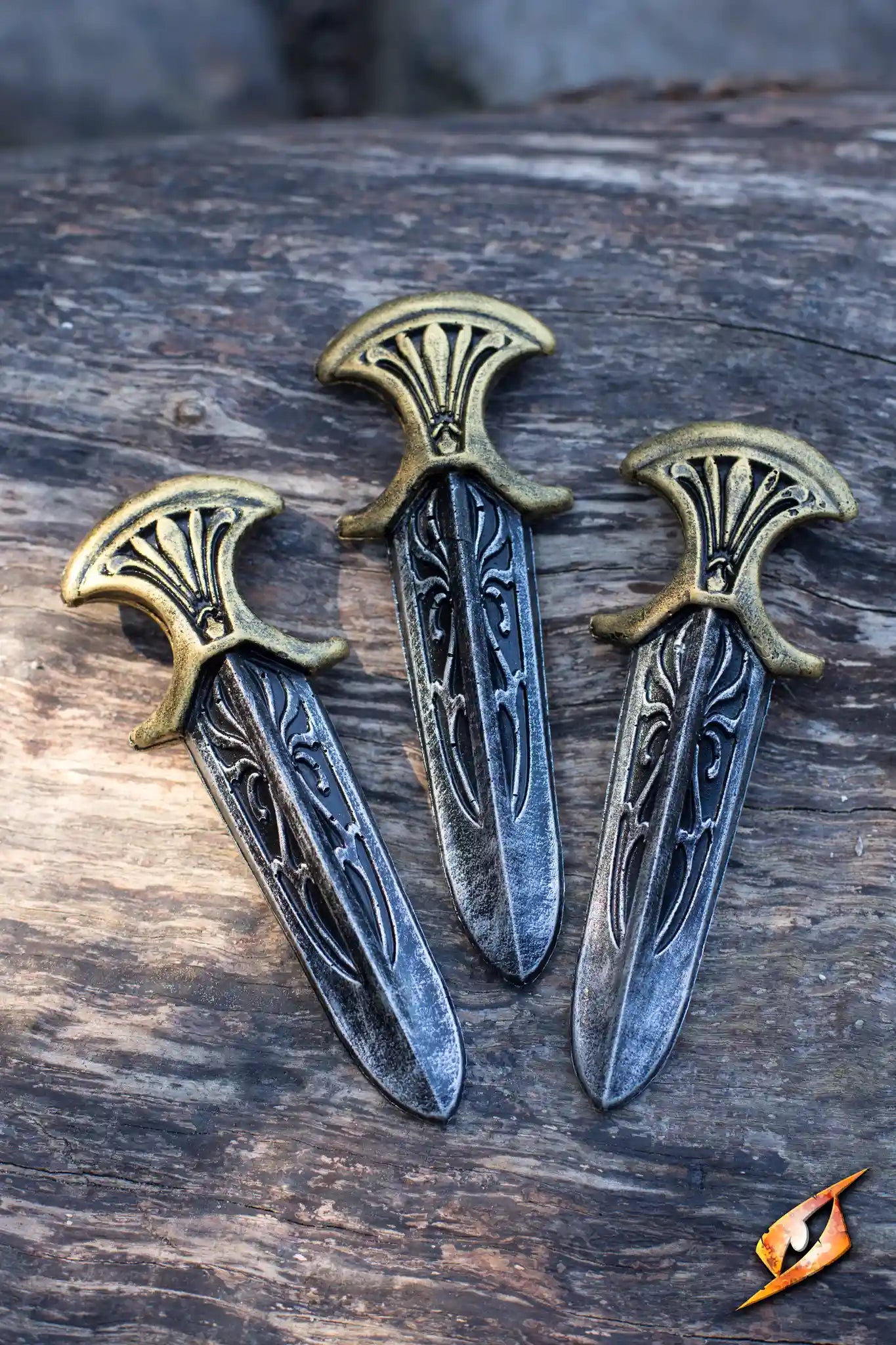 Assassin Inquisitor Knives - 13 cm 3 pcs displayed on wooden surface, highlighting intricate designs and craftsmanship.