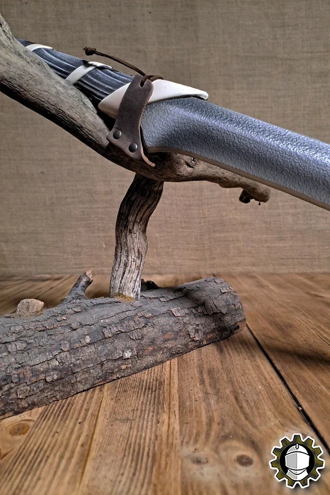 Blade Hook (New Blood) securing a blade on a wooden display stand, showcasing its sleek design and functionality.