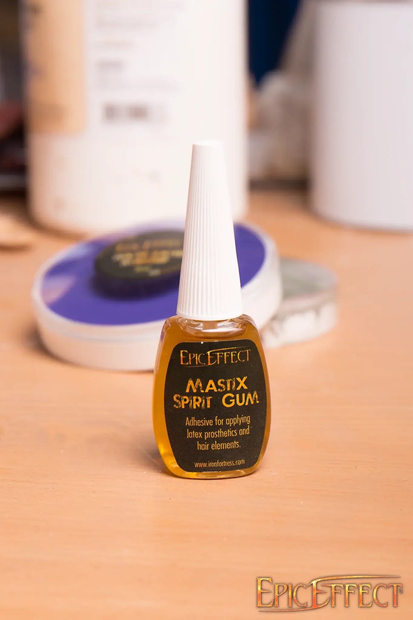 Mastix Spirit Gum 12 ml bottle with adhesive for applying latex prosthetics and hair, featuring screw-on lid.