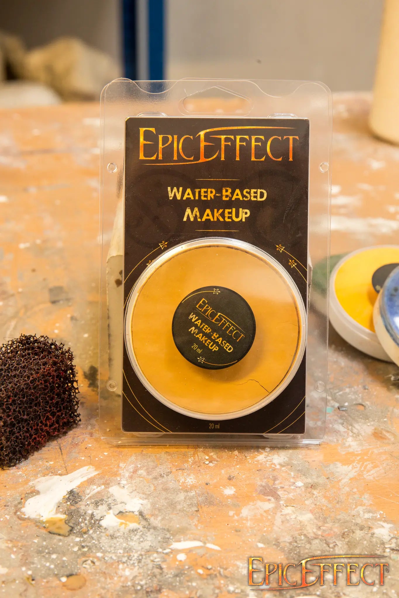 Water Based Make Up - Umbra - Yellow by Epic Effects in a compact packaging on a work surface.
