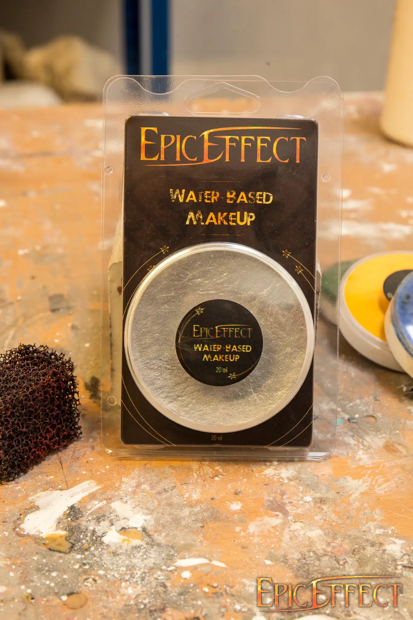 Water Based Make Up - Silver compact powder makeup by Epic Effects, in packaging on a work surface.
