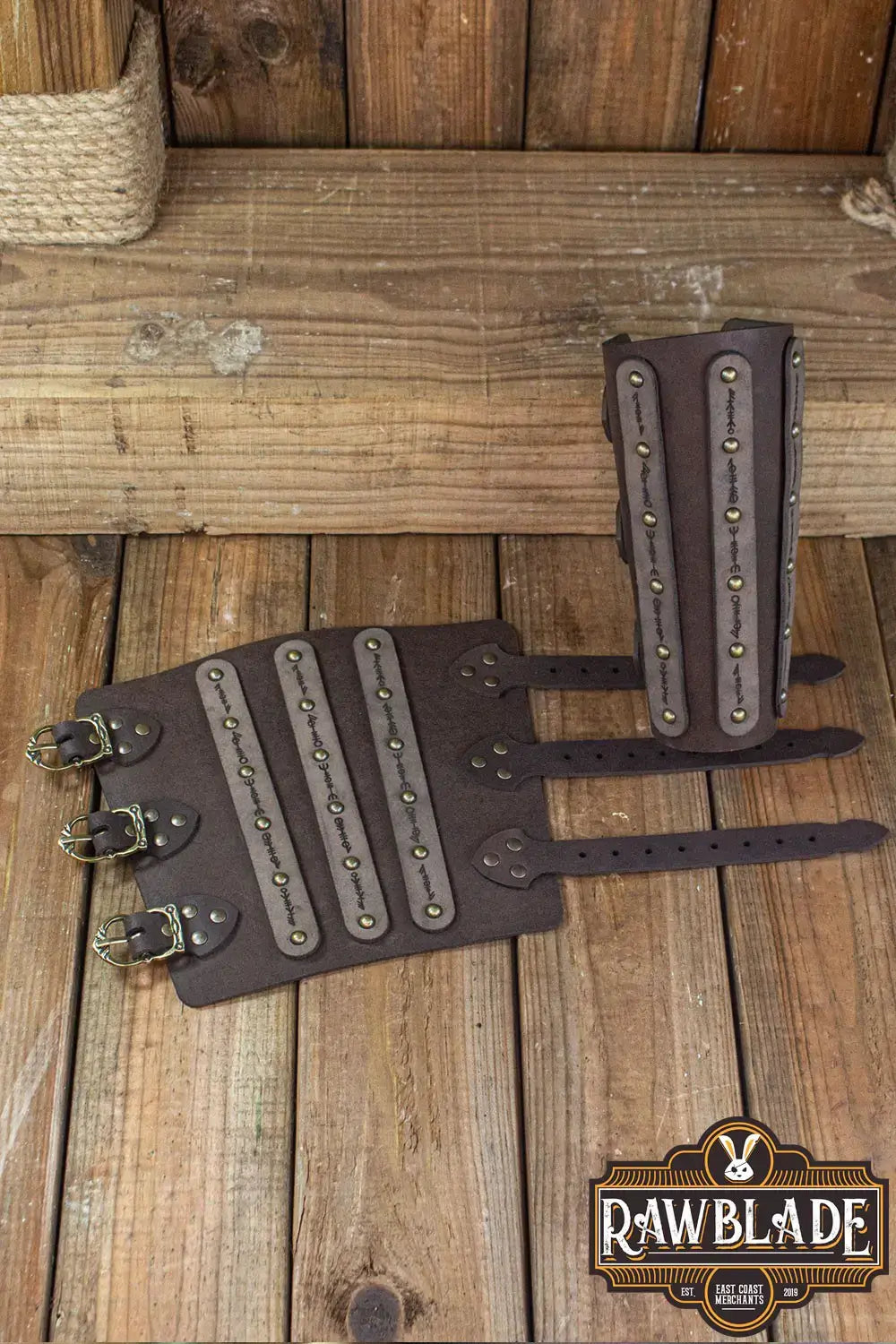 Hirdman Bracers, leather bracelets with engraved straps and studs, perfect for medieval fairs and LARP events.