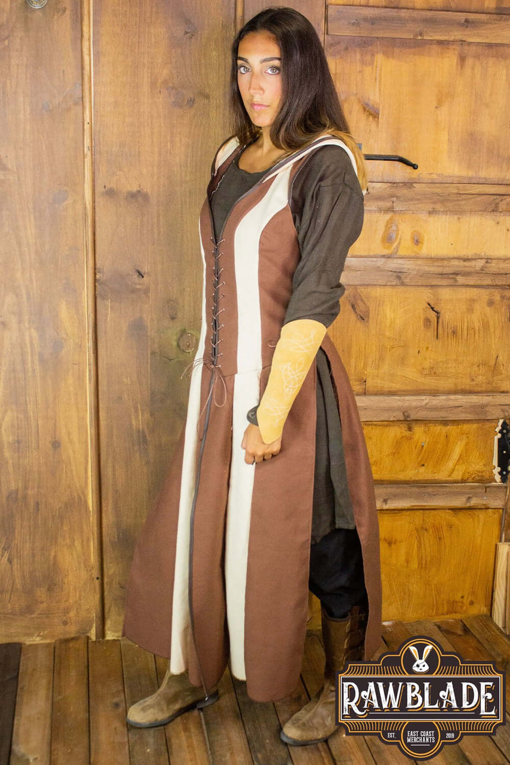 Arylith Archer Cotton Tunic worn by a model, showcasing adjustable drawstrings and a stylish hood in rich colors.