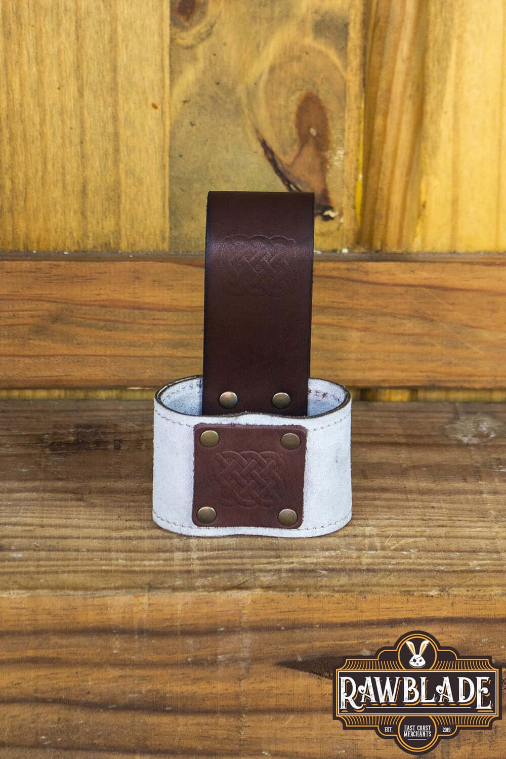 Wanderer Holder featuring engraved split leather, Celtic designs, stitched borders, and old gold rivets.